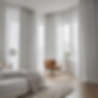 Elegant white curtains enhancing a minimalist bedroom